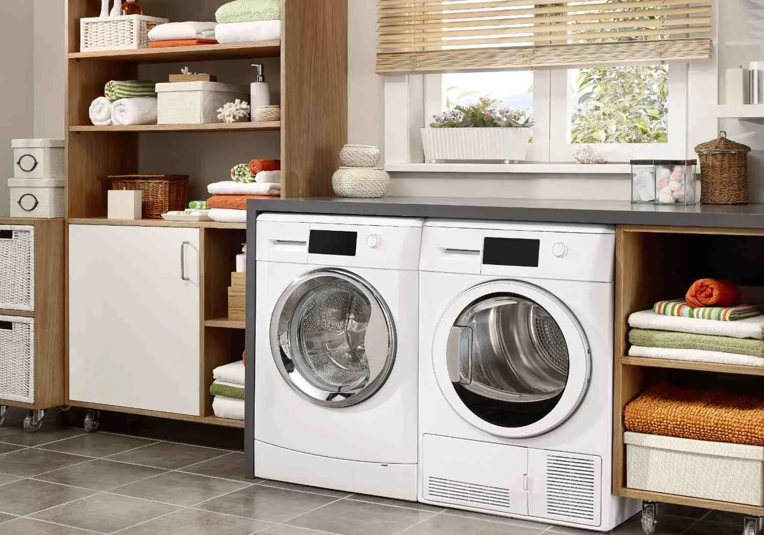 Washer and dryer side by side in a laundry room